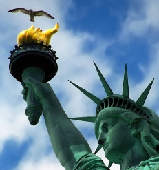 Statue of Liberty holds up torch and seagull flies overhead