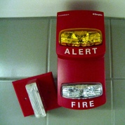 Picture of a professional quality alarm clock with flashing light fire alerts.